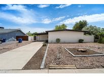 Charming single story home featuring a front yard with desert landscaping at 1939 E Alameda Dr, Tempe, AZ 85282