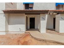 Inviting front entrance featuring a black front door and well-maintained walkway at 2121 W Union Hills Dr # 113, Phoenix, AZ 85027