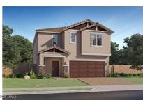 Charming two-story home featuring a two-car garage and well-manicured lawn at 23178 W Marguerite Ave, Buckeye, AZ 85326