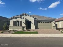 Charming single-story home with a well-manicured lawn and neutral-toned stucco, presenting a welcoming facade at 3248 W San Cristobal Rd, San Tan Valley, AZ 85144