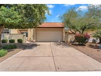 Charming single-level home featuring a two-car garage and mature landscaping in a well-maintained community at 560 W Duke Dr, Tempe, AZ 85283