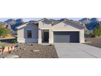 Charming single-story home featuring a two-car garage, desert landscaping, and a neutral color palette at 5845 E Axle Ln, San Tan Valley, AZ 85140