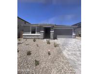 Charming single-story home featuring stone accents and a low-maintenance desert landscape at 18708 E Helian Dr, Gold Canyon, AZ 85118