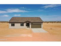Charming single-story home featuring desert landscaping and a neutral color scheme at 5937 N Nigal Rd, Casa Grande, AZ 85194