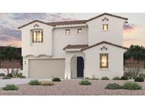 Two-story home featuring a desert-landscaped front yard, a garage, and a classic tile roof at 18058 W Creedance Blvd, Surprise, AZ 85387