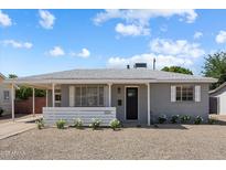 Charming single-story home with a well-maintained front yard and covered entry at 2223 E Roma Ave, Phoenix, AZ 85016