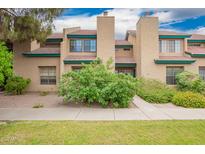 Inviting two-story townhome with desert landscaping and a red tile roof at 225 W 1St St # 107, Mesa, AZ 85201