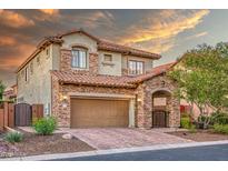 Beautiful two-story home featuring stone accents, a tile roof, and a spacious two-car garage at 7252 E Nance St, Mesa, AZ 85207