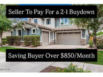 Charming two-story home featuring a three-car garage and well-maintained landscaping at 7528 E Peralta Ave, Mesa, AZ 85212