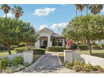 Charming home featuring manicured landscaping, a brick walkway, and a welcoming front entrance at 1330 N 40Th St # 1, Mesa, AZ 85205