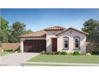 Charming single-story home with a terracotta tile roof, well-manicured lawn, and a two-car garage at 17479 W Victory St, Goodyear, AZ 85338