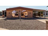 Charming single-story home with covered parking and easy-care gravel landscaping at 5221 E Mills Ct, Mesa, AZ 85215