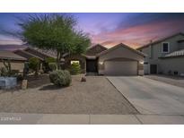 Charming single-story home showcasing desert landscaping and a spacious two-car garage at 7937 W Chickasaw St, Phoenix, AZ 85043