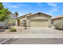 Charming single-story home with a well-manicured front yard and two car garage at 110 E Saddle Way, San Tan Valley, AZ 85143