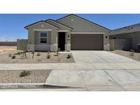 Charming single-story home featuring a two-car garage and low-maintenance landscaping in a sunny setting at 46484 W Lander Ln, Maricopa, AZ 85139