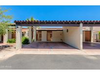 Attached carport featuring a brown beam and tile roof providing covered parking at 6 E Manzanita Dr, Phoenix, AZ 85020