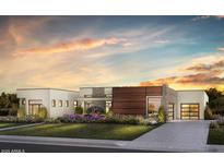 Stunning modern home featuring mixed materials and lush landscaping at 6145 E Gold Dust Ave, Paradise Valley, AZ 85253
