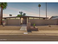 Stunning mid-century modern home with well maintained desert landscaping and a private, enclosed front yard at 7604 N 46Th Ave, Glendale, AZ 85301