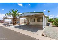 Charming single-story home featuring a covered carport and low-maintenance landscaping at 7807 E Main St # Cc-71, Mesa, AZ 85207
