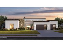 Modern home featuring stone accents, a two-car garage, and beautiful landscaping at 8300 E Dixileta Dr # 306, Scottsdale, AZ 85266