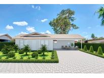 Charming single-story home with a well-manicured front yard and a long driveway at 875 E Flint St, Chandler, AZ 85225