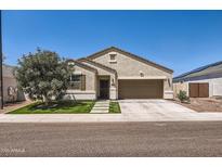 Charming single-story home with desert landscaping, walkway, and neutral stucco exterior at 94 S 189Th Ln, Buckeye, AZ 85326