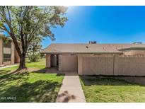 Inviting single-story home featuring a well-maintained lawn and cozy entrance at 17830 N 45Th Ave, Glendale, AZ 85308