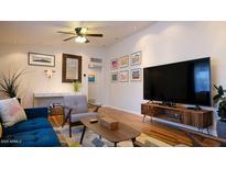 Stylish living room with modern furnishings, decor, and beautiful hardwood floors at 2214 N 7Th Ave, Phoenix, AZ 85007