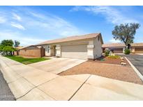 Charming single-story home features a well-maintained front yard and a convenient two-car garage at 2221 E Union Hills Dr # 148, Phoenix, AZ 85024