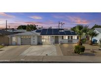 Charming home featuring solar panels, a desert-landscaped front yard, and a freshly painted exterior at 2608 W Columbine Dr, Phoenix, AZ 85029