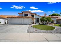 Beautiful two-story home featuring a well-maintained front yard and a three-car garage at 5341 W Bloomfield Rd, Glendale, AZ 85304
