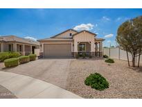 Beautiful single-story home featuring a neutral color palette, paver driveway, and low maintenance desert landscaping at 6550 S 24Th Pl, Phoenix, AZ 85042