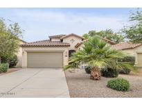 Charming single-story home featuring a well-manicured front yard and a two-car garage at 36199 W Prado St, Maricopa, AZ 85138