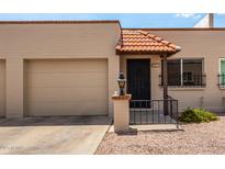 Charming home featuring a decorative tile roof over the front entryway and a single-car garage on the left side at 440 S Parkcrest -- # 145, Mesa, AZ 85206