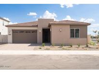 Charming single-story home with a two-car garage and desert landscaping at 1903 E Empeltre Rd, San Tan Valley, AZ 85140