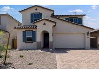 Charming home with a two-car garage and low maintenance landscaping at 32499 N 122Nd Ave, Peoria, AZ 85383