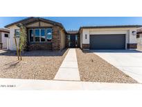 Charming single-story home featuring stone accents, a two-car garage, and desert landscaping at 39640 N Kaden Ln, San Tan Valley, AZ 85140