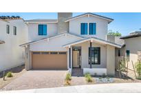 Stunning two-story home boasts a modern design, desert landscaping, and a stylish garage door at 6722 N 9Th Dr, Phoenix, AZ 85013