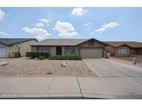 Charming single-story home featuring a low-maintenance desert landscape and a two-car garage at 8943 W Sierra Vista Dr, Glendale, AZ 85305