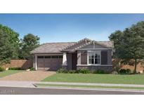 Charming single-story home featuring a neutral palette, paired garage and manicured lawn at 1516 W Ridge Rd, Apache Junction, AZ 85120