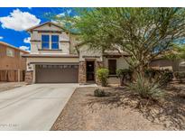 Charming two-story home with a well-maintained lawn and a two-car garage at 2748 E Dennisport Ave, Gilbert, AZ 85295