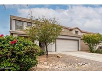 Charming home featuring a two-car garage and lovely desert landscaping at 41678 N Salix Dr, San Tan Valley, AZ 85140