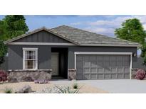 Charming single-story home featuring a two-car garage, stone accents, and neutral color scheme at 6041 E Artemis Dr, Florence, AZ 85132