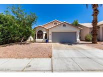 Charming single-story home with a two-car garage and low maintenance desert landscaping at 840 E Baylor Ln, Chandler, AZ 85225