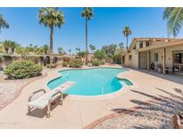 Backyard pool featuring a diving board and desert landscaping at 6931 E Pershing Ave, Scottsdale, AZ 85254
