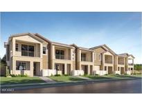 Attractive townhouse-style homes with a combination of light tan and dark tan finishes and a modern architectural design at 8149 E Petunia Ave # 1060, Mesa, AZ 85212