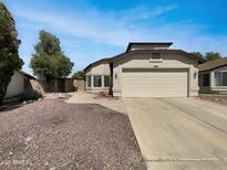 Charming single-story home featuring a well-maintained yard and a two-car garage at 8831 N 63Rd Dr, Glendale, AZ 85302