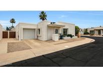 Inviting single-story home with a two-car garage, desert landscaping, and charming curb appeal at 1122 E Michelle Dr, Phoenix, AZ 85022