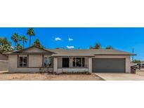 Charming single-story home with an attached garage and desert landscaping at 17201 N 35Th Dr, Glendale, AZ 85308