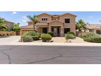 Beautiful two-story home with desert landscaping and a well-maintained front yard at 18432 W Port Royale Ln, Surprise, AZ 85388